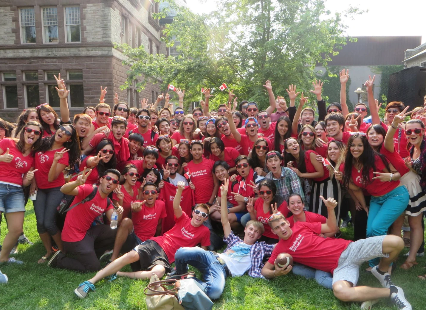 Group of ILAC students at an event wearing red school shirts
