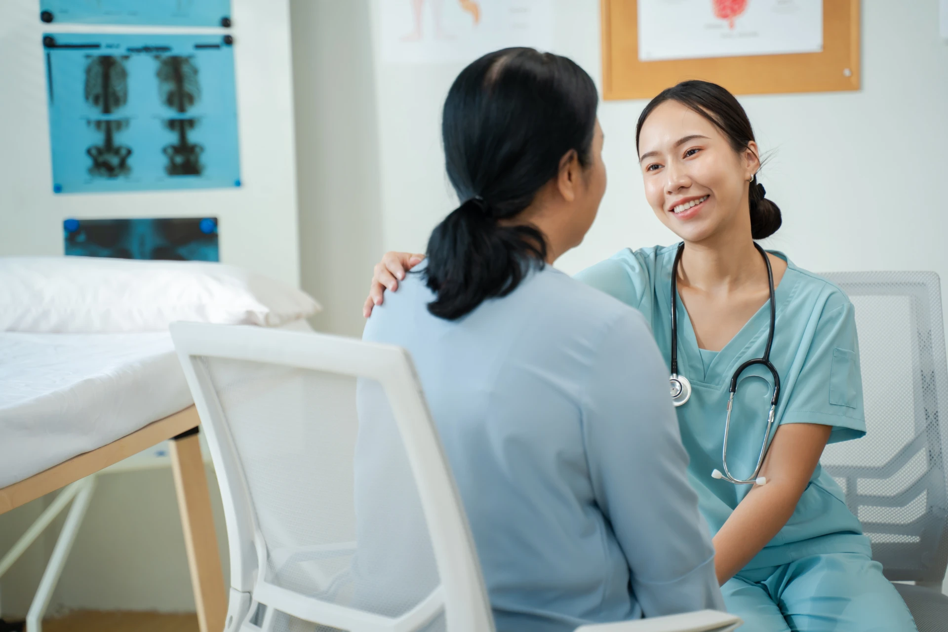 Health care professional reassuring a patient in a clinic