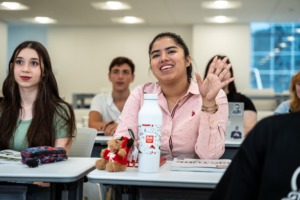 An ILAC HS student raises their hand to ask a question.