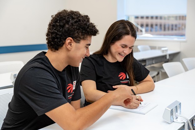 : A pair of international high school students studying in a classroom at ILAC